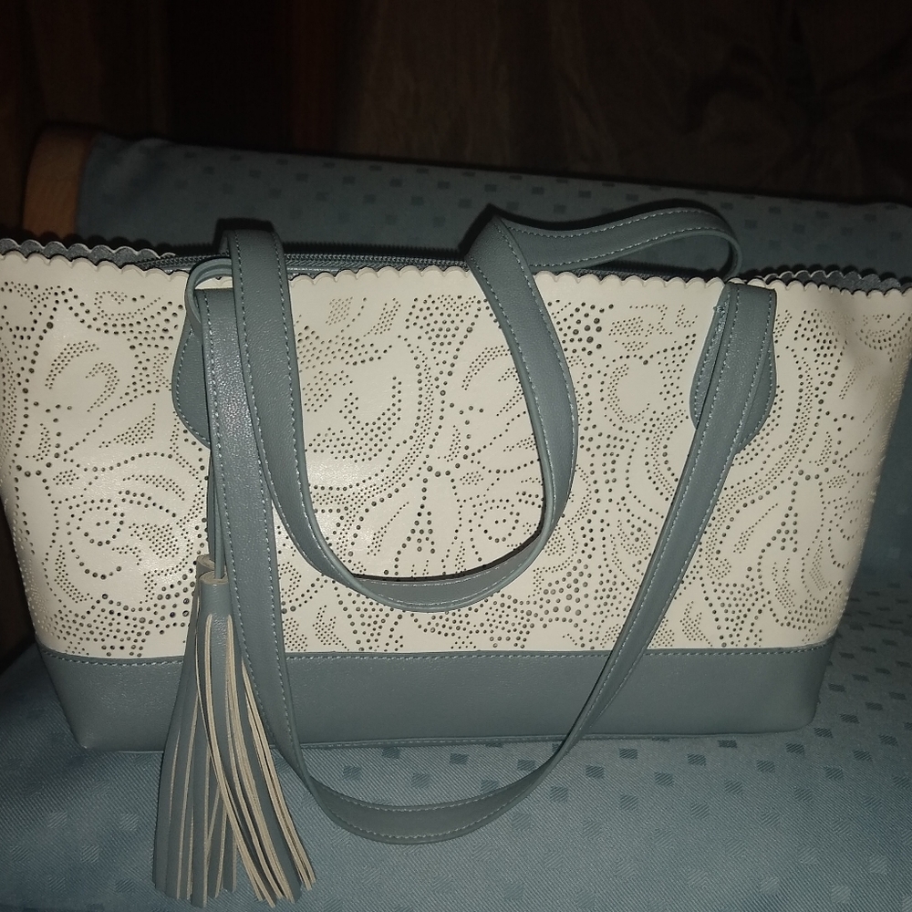 Buco laser lacy cut tote bag .